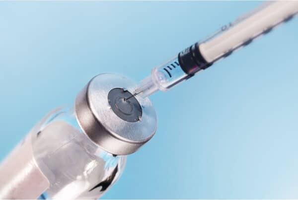 addiction specialist prepares injection of MAT medication like sublocade or vivitrol
