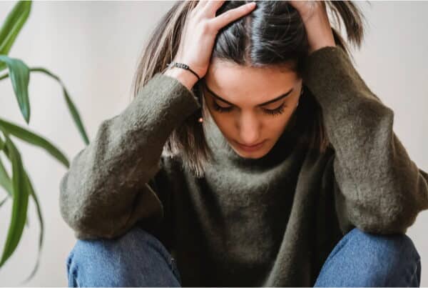woman experiences symptoms of either anxiety or OCD