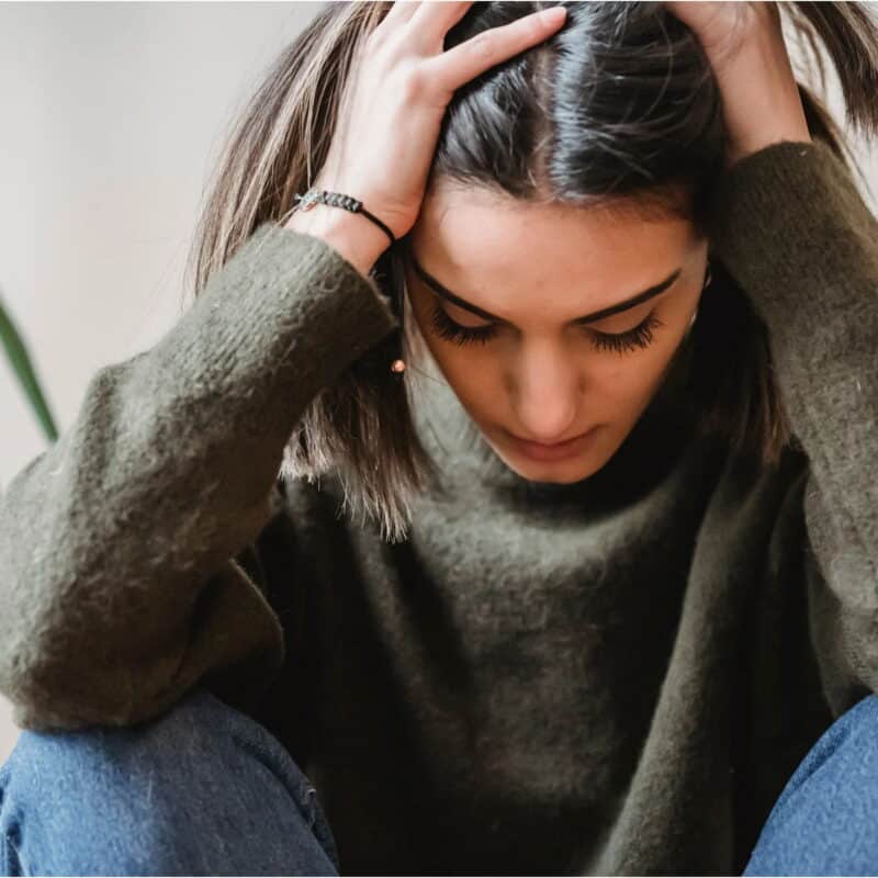 woman experiences symptoms of either anxiety or OCD